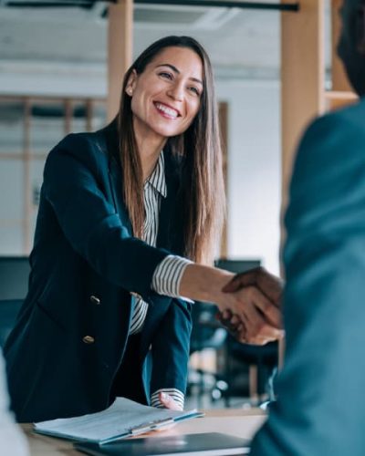 Female-human-resource-manager-shaking-hands-with-newly-hired-employees